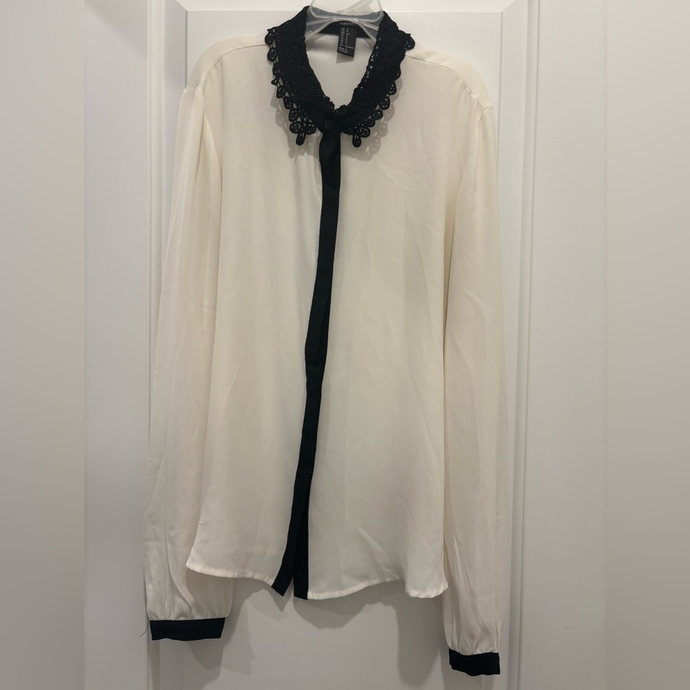 White blouse with black trim details. Size small from Forever 21